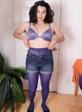 Brunette parts with purple pantyhose to show unshaven cunt