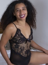 Curly-haired Ebony mom peels off lingerie and reveals her sexy bush