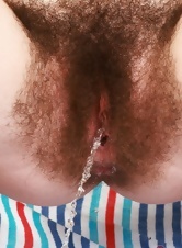 Her sexy hairy pussy and her tattooed body are perfect